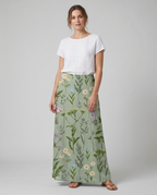 Green field-print A-line skirt with pockets, midi length, worn front view