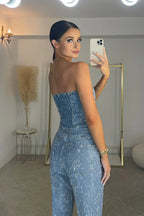 Blue strapless sequin jumpsuit with side seam detailing and fitted straight legs