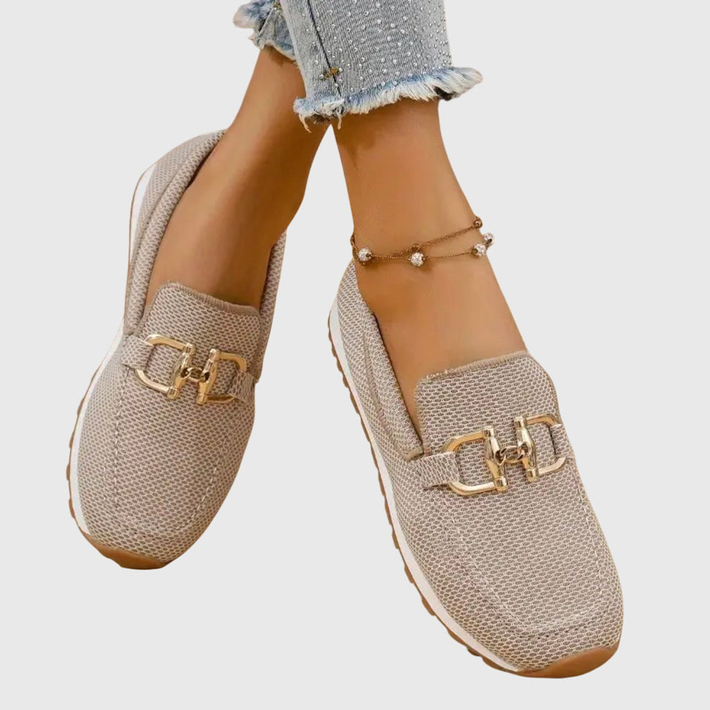 Beige orthopedic loafer shoes with textured knit, gold buckle-bit detail, low tread sole