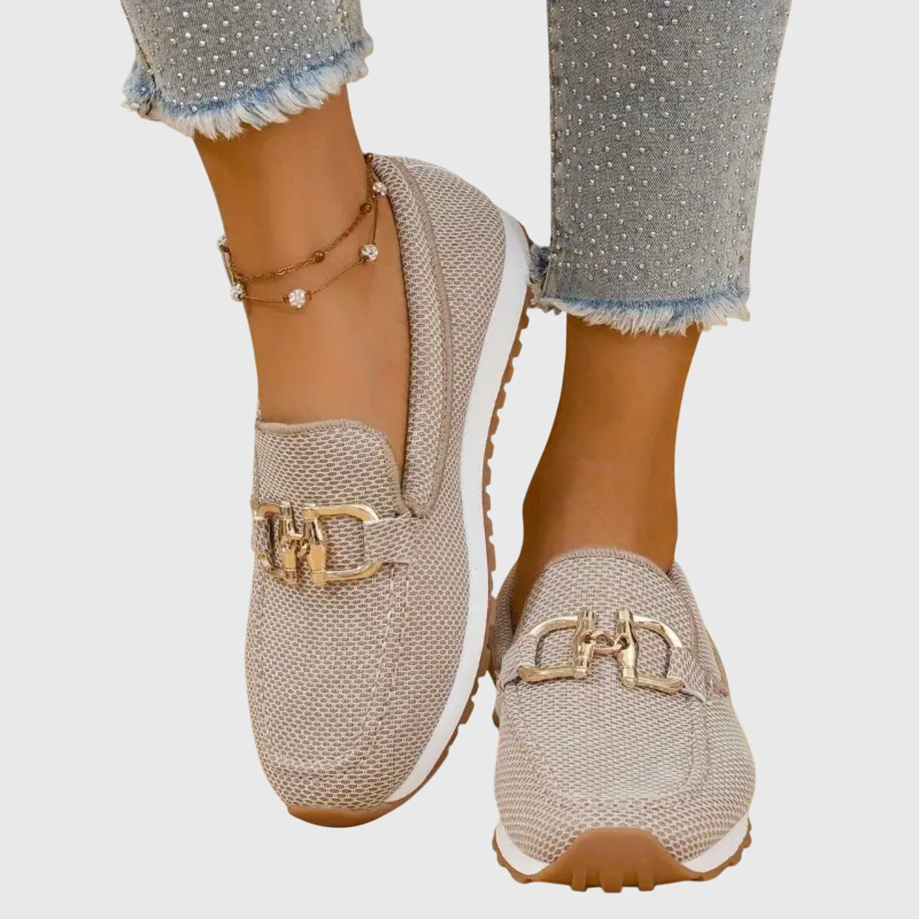 Beige orthopedic loafer shoes with textured knit, gold buckle-bit detail and grippy outsole