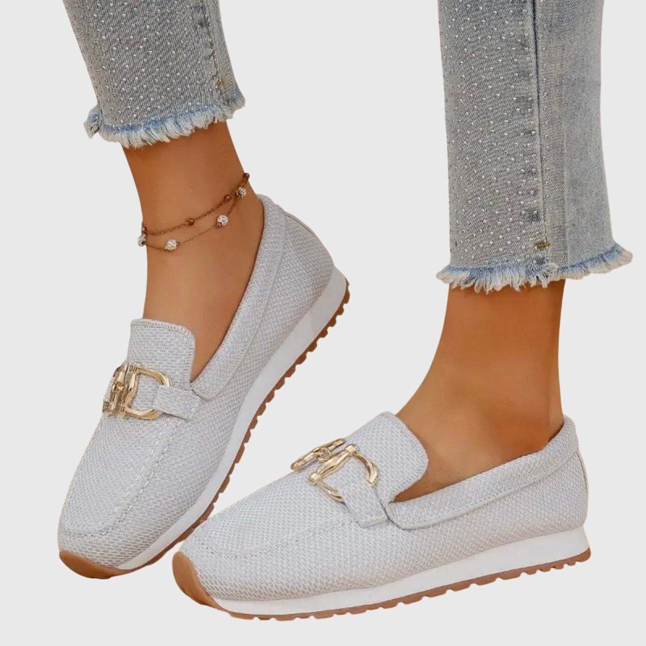Gray orthopedic loafer shoes with textured knit, gold buckle-bit detail and low profile sole
