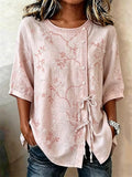 Pink floral embroidered half-sleeve blouse with lace-trim round neck and button placket