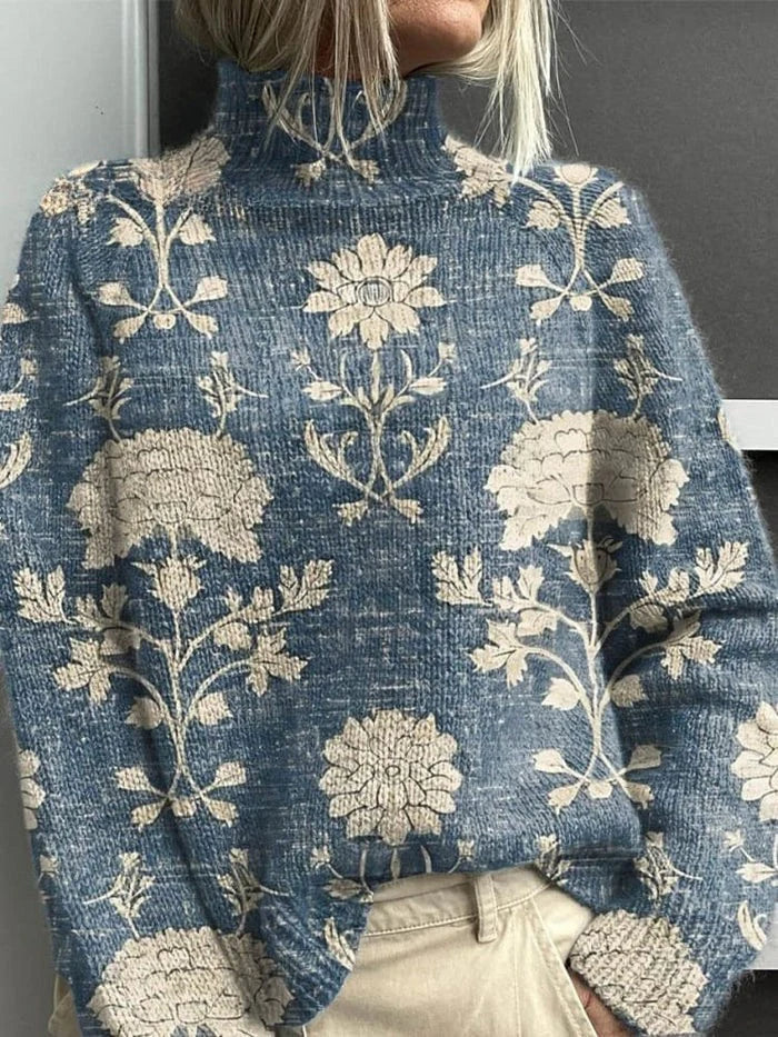 Blue ribbed turtleneck sweater with beige floral and leaf print
