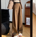 Brown corduroy wide-leg high-rise trousers with belt and relaxed straight legs