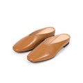Brown leather flats with pointed toe, low heel, slip-on style