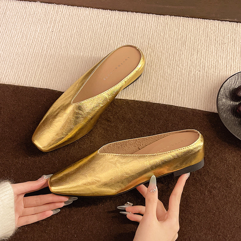 Gold metallic leather flats with pointed toe, low heel, slip-on style
