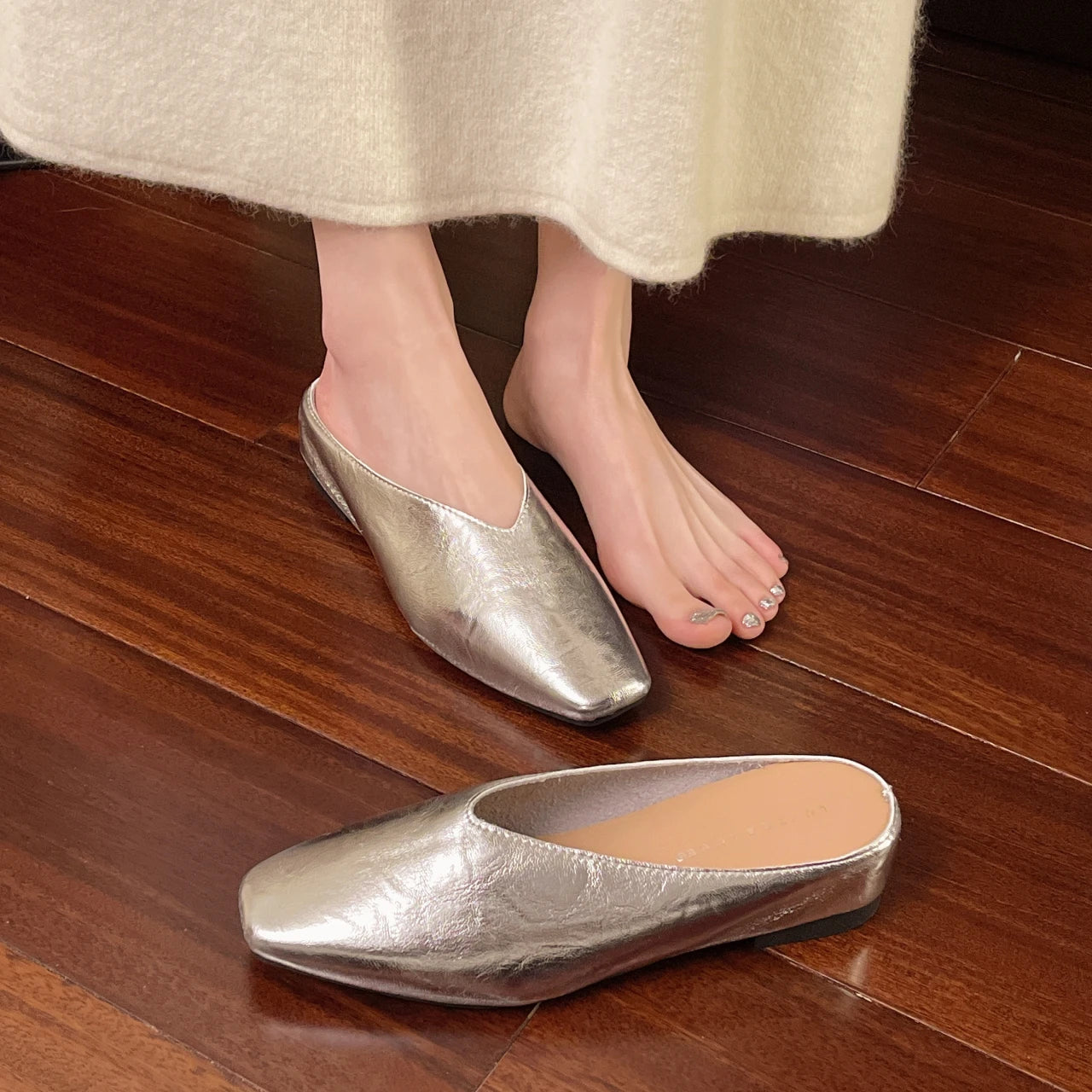 Silver leather flats with pointed toe, low heel, slip-on style