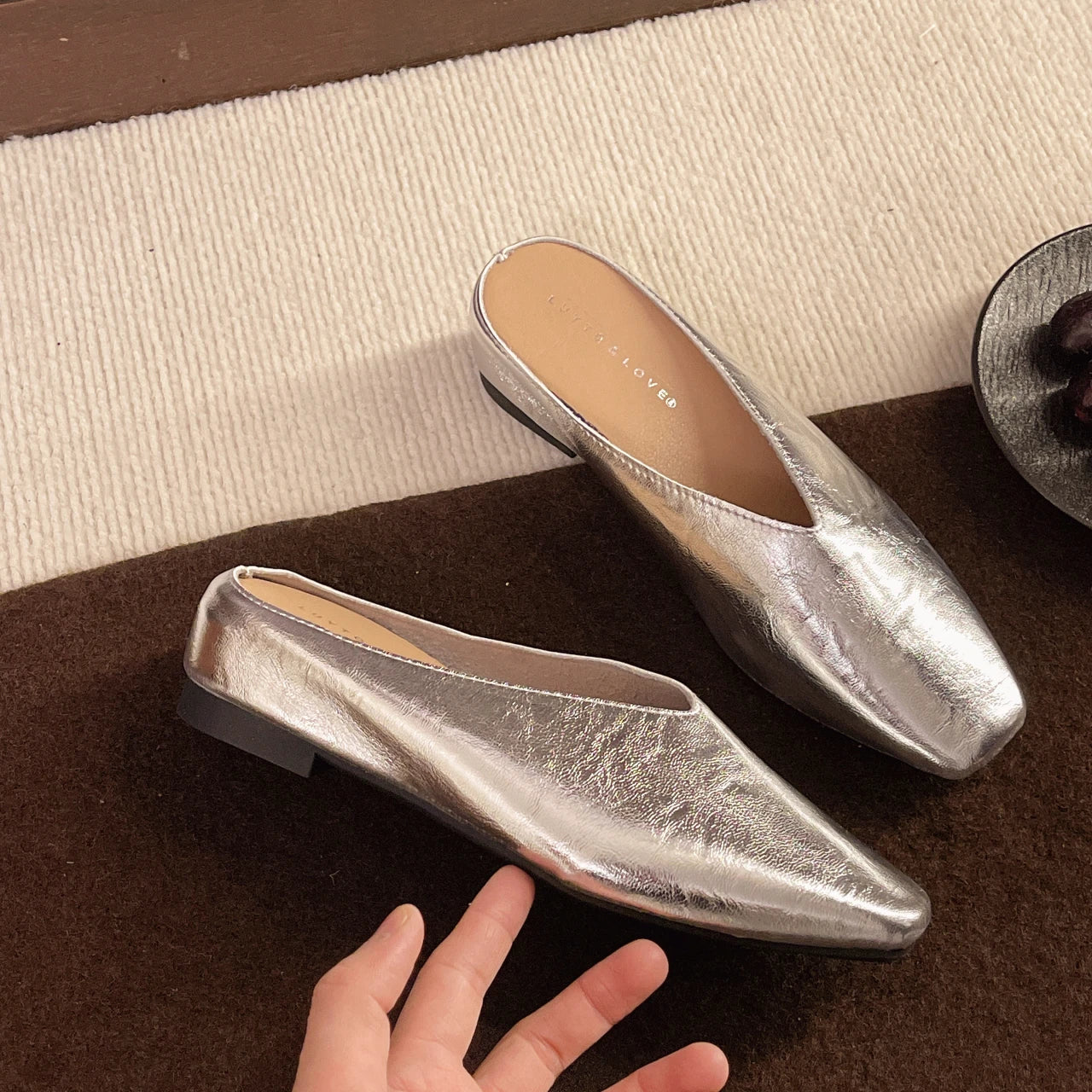 Silver leather flats with pointed toe, low heel, slip-on style