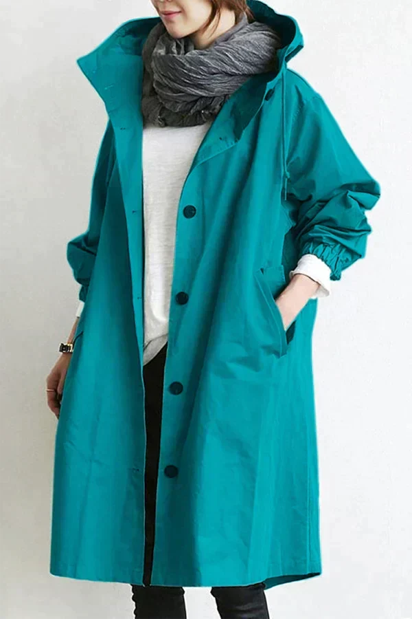 Turquoise women's waterproof raincoat with oversized hood, button front, long sleeves