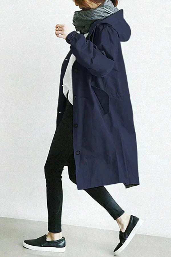 Navy blue womens waterproof raincoat with oversized hood and button front