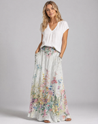 Floral maxi A-line skirt with elastic waist, white base with colorful botanicals