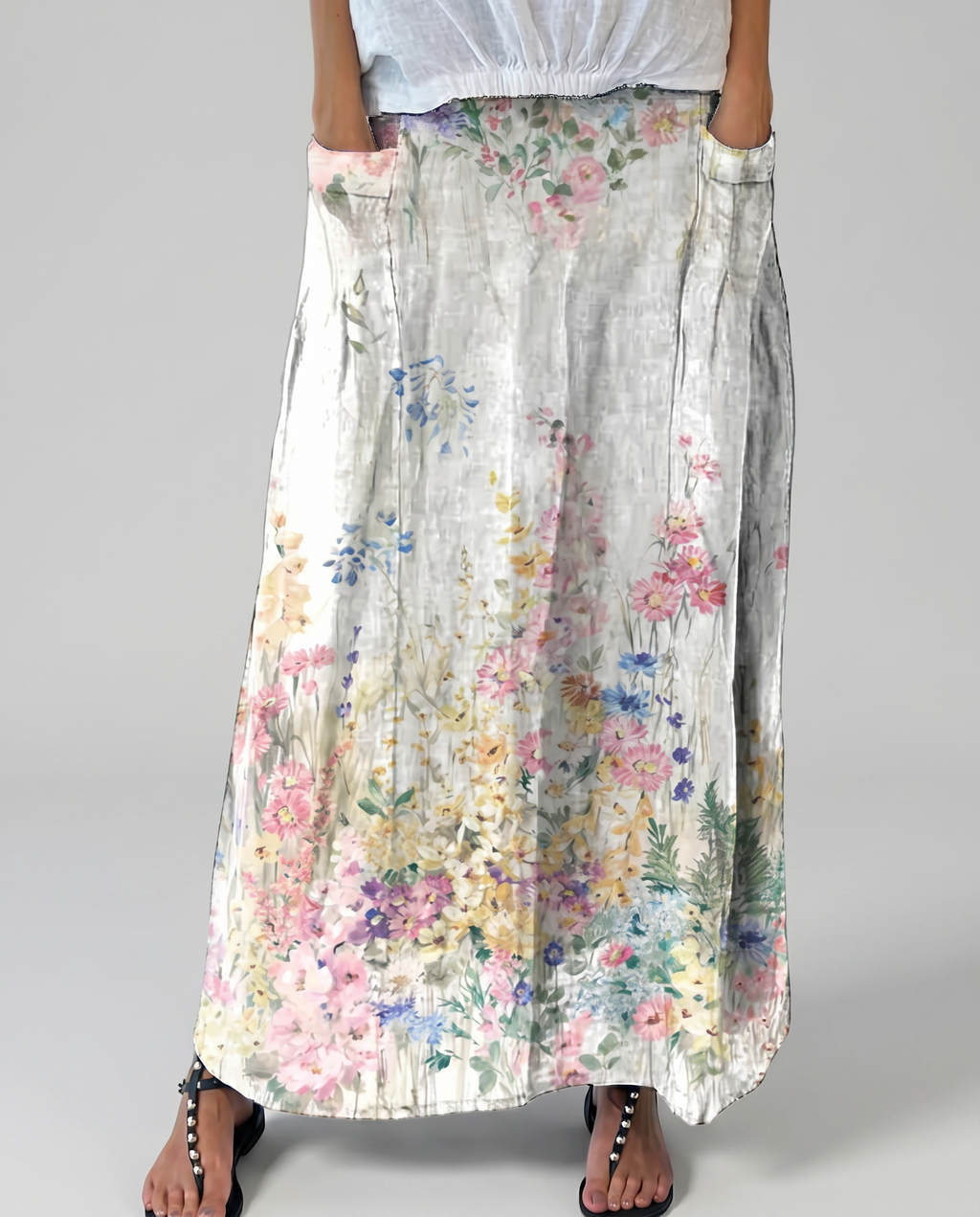 Floral A-line maxi skirt with elastic waist, light base and scattered botanical blooms