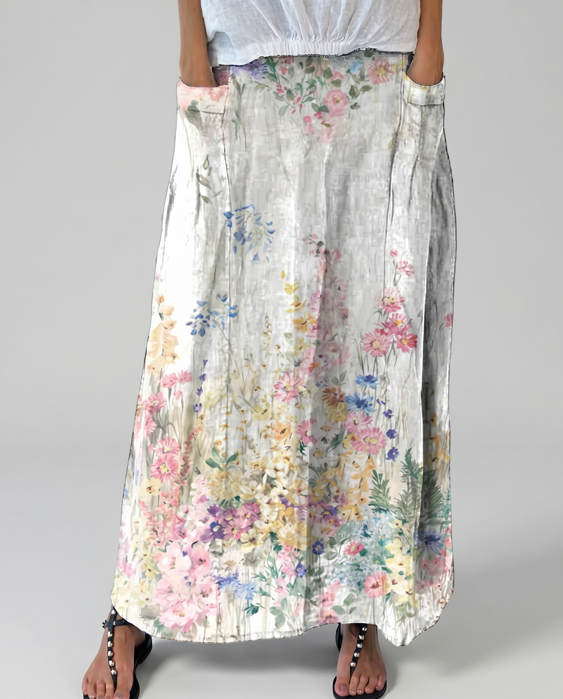 Floral A-line maxi skirt with elastic waist, light base and scattered botanical blooms