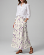 Floral print A-line pocket skirt with gathered waist, side pockets and purple flower pattern