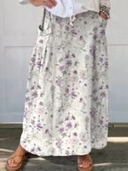 Floral print A-line skirt with side pockets, gathered waist, purple blossoms on light ground