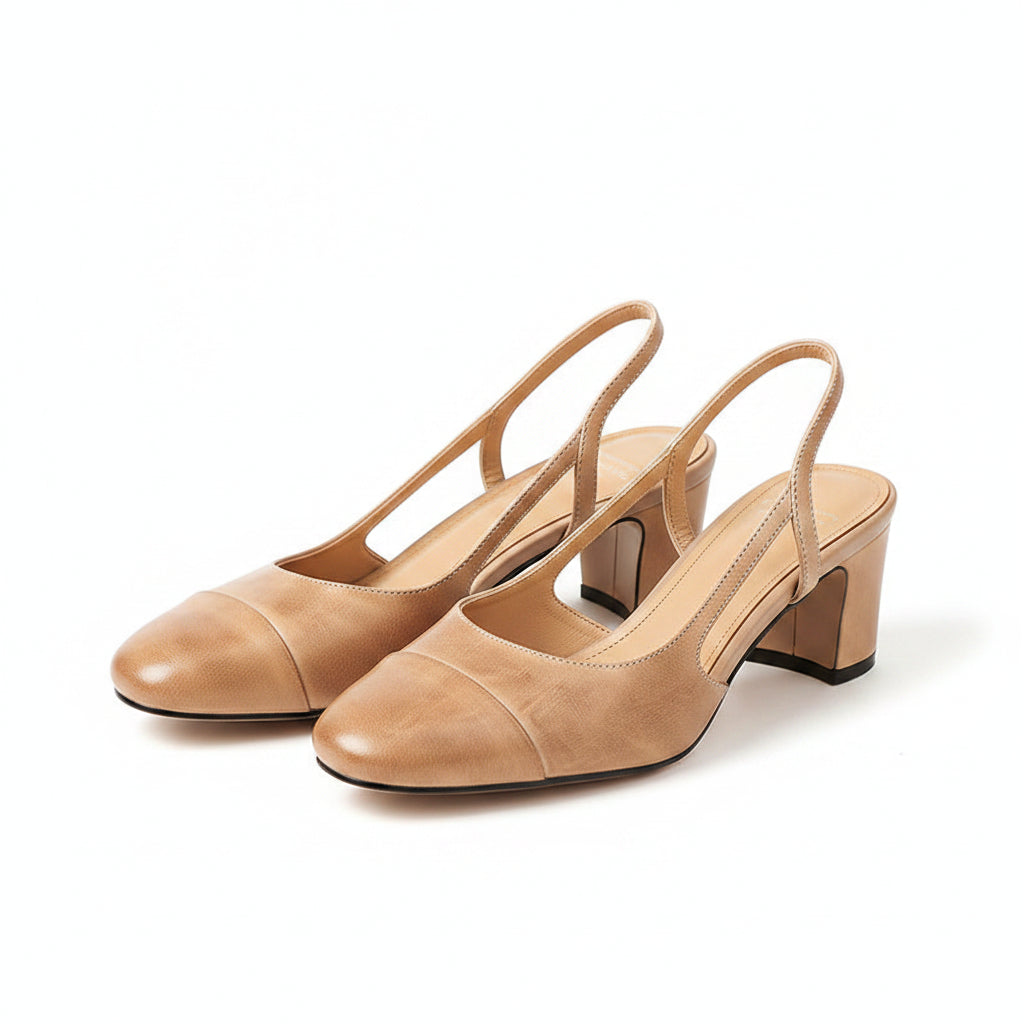 Beige leather heeled mule with open back and block heel, close-up