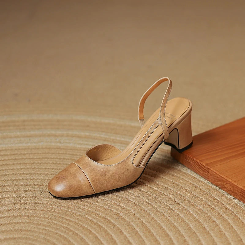 Beige leather heeled slingback shoe with square toe and block heel