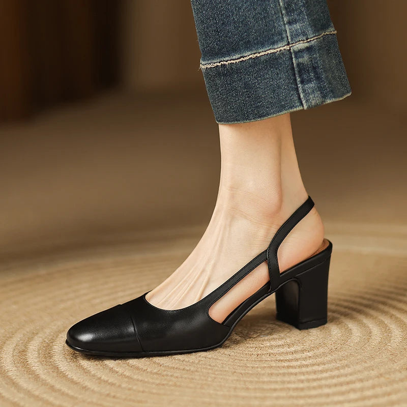 Black leather heeled slingback pumps with T-strap and block heel
