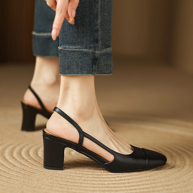 Black leather heeled slingback pumps with ankle strap and block heel