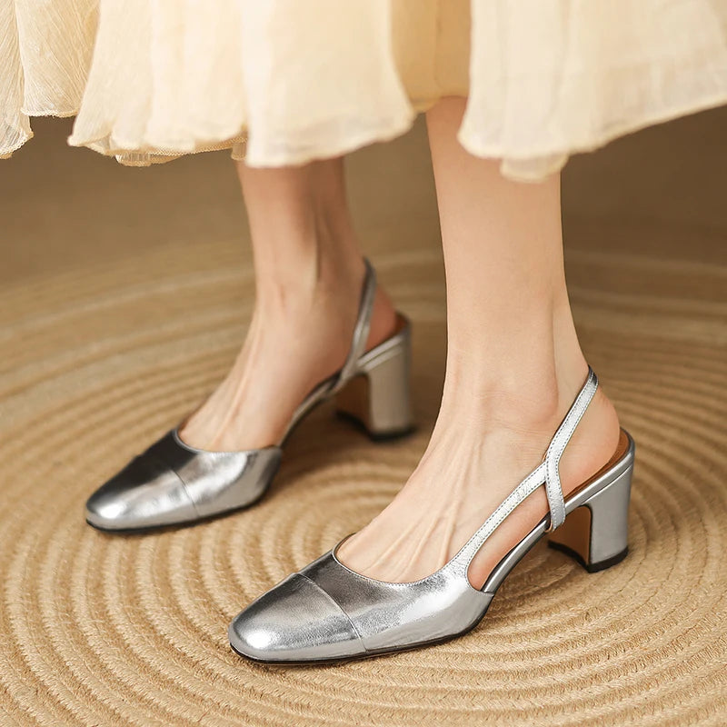Silver leather heeled slingback pumps with pointed toe and block heel