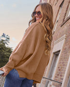 Taupe oversized knit pullover sweater from back with dropped sleeves