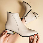Off-white ankle boots with side zipper and block heel, rounded toe