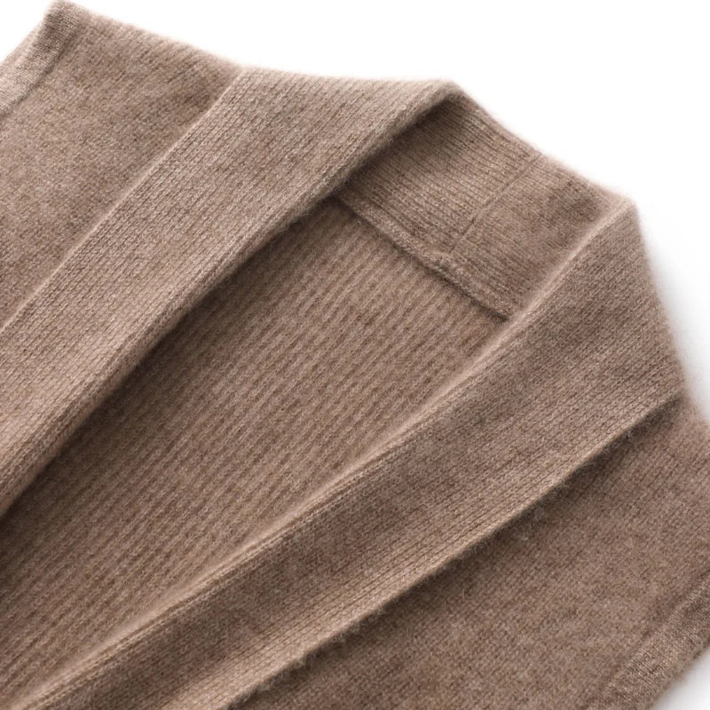 Women’s merino wool sweater vest detail, rib-knit fabric and V-neck seam in camel beige