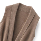 Camel merino wool sweater vest knit, showing ribbed collar and V-panel stitching detail.