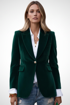 Green women’s blazer with notched lapels, gold button closure, and flap pockets