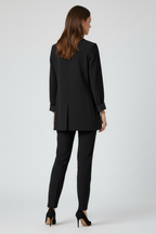 Women's black longline blazer with cuffed sleeves, back view
