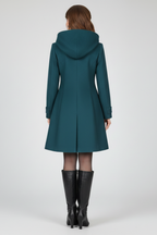 Teal women’s hooded double-button coat, back view with center seams