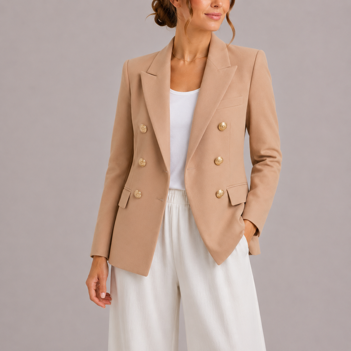 Beige double-breasted blazer with gold-tone buttons, notched lapels and tailored fit