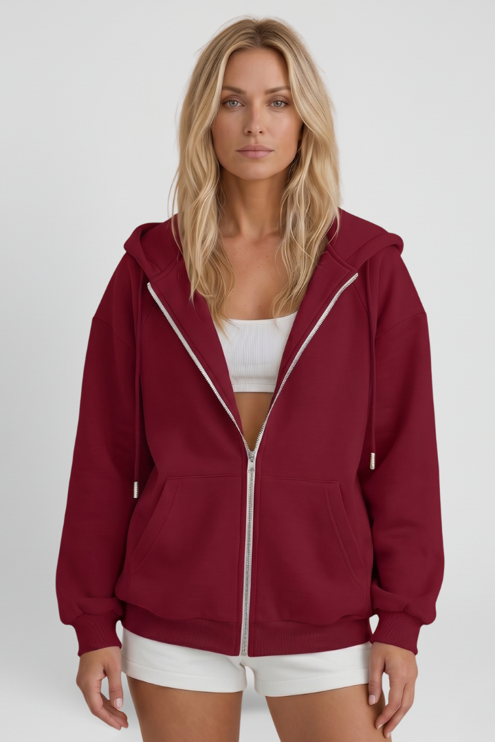 Burgundy hooded zip jacket with drawstring cords and asymmetrical front zipper, front view