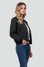Women's black quilted jacket with front zip closure, model side view, ribbed hem and cuffs