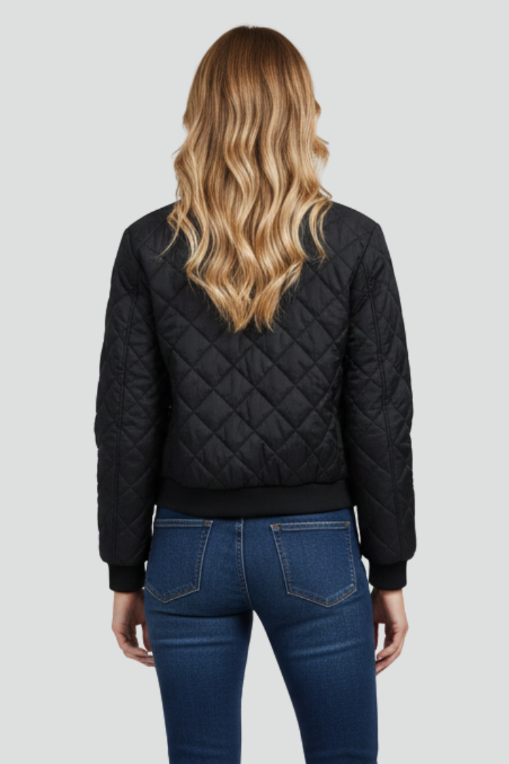 Women's black quilted zip-up jacket, back view, diamond pattern, ribbed cuffs