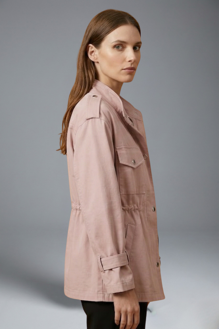 Women’s utility jacket in light pink, side view with flap chest pockets and waist tie