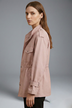 Women’s utility jacket in light pink, side view with flap pockets and button front