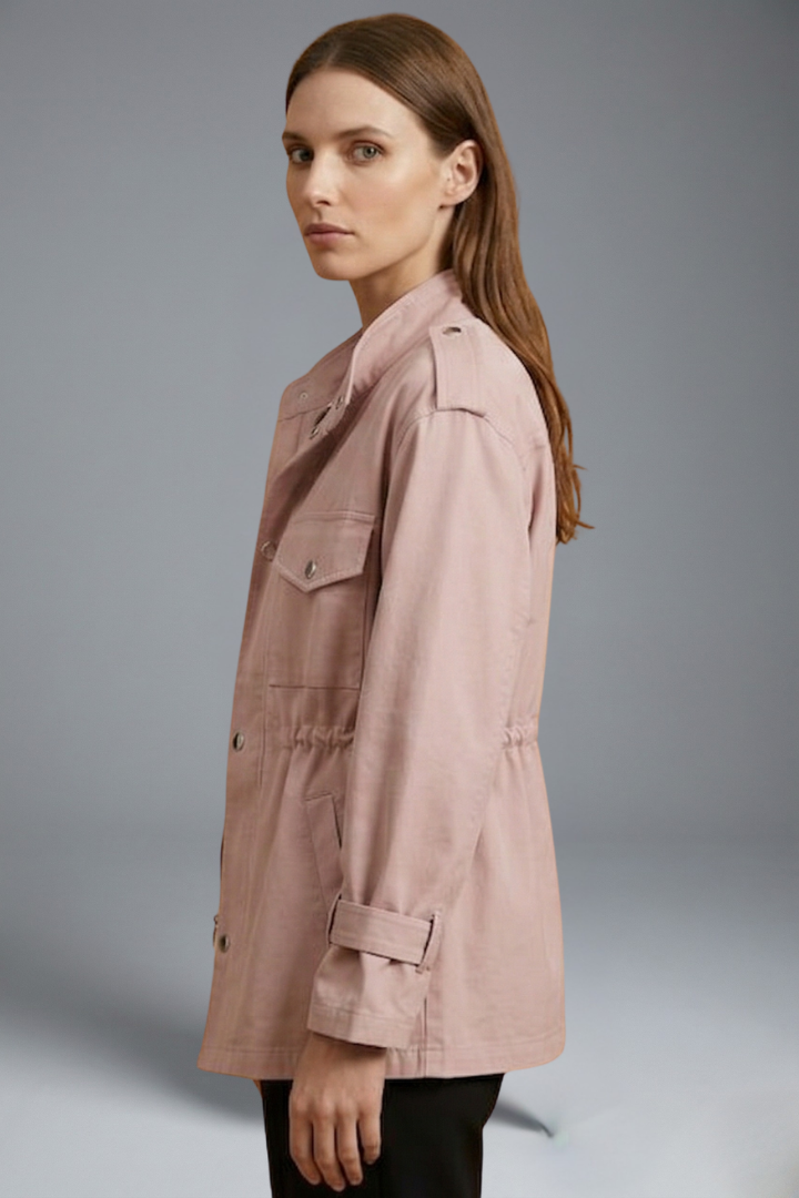Women’s utility jacket in light pink, side view with flap pockets and button front