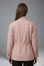 Women’s utility jacket in light pink, back view with gathered waist and button-up closure