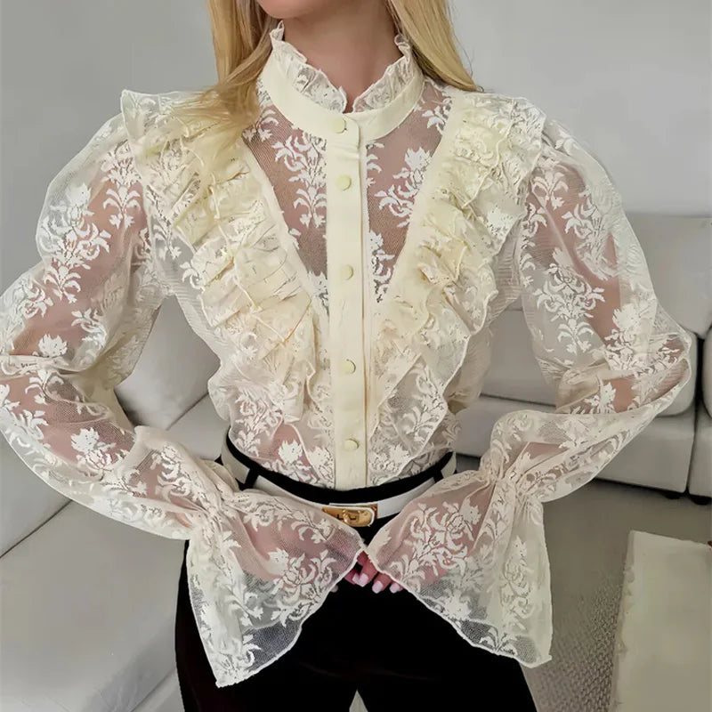 Cream sheer lace blouse with ruffled front and button-up placket
