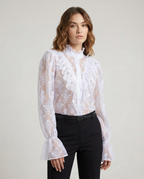 White sheer lace blouse with ruffled bib front and long puff sleeves