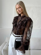 Brown sheer lace blouse with ruffled shoulders and long flared sleeves