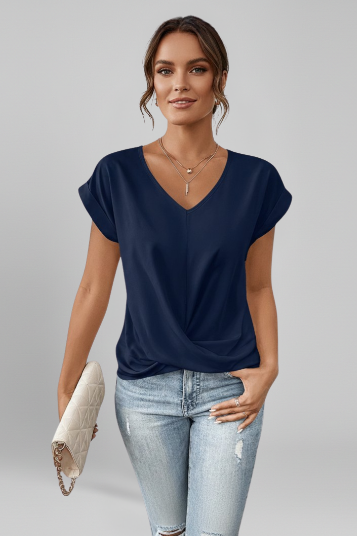 V-neck short-sleeve blouse in dark blue, twisted front detail at waist.