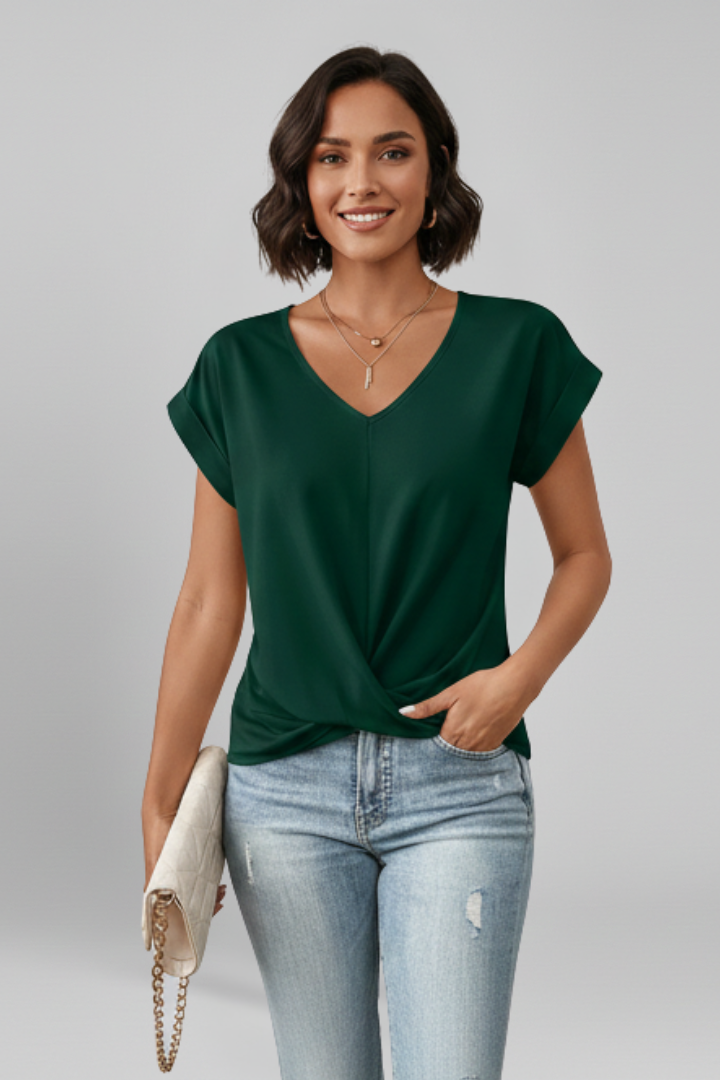 V-neck short-sleeve blouse in dark green, twisted front drape at waist.