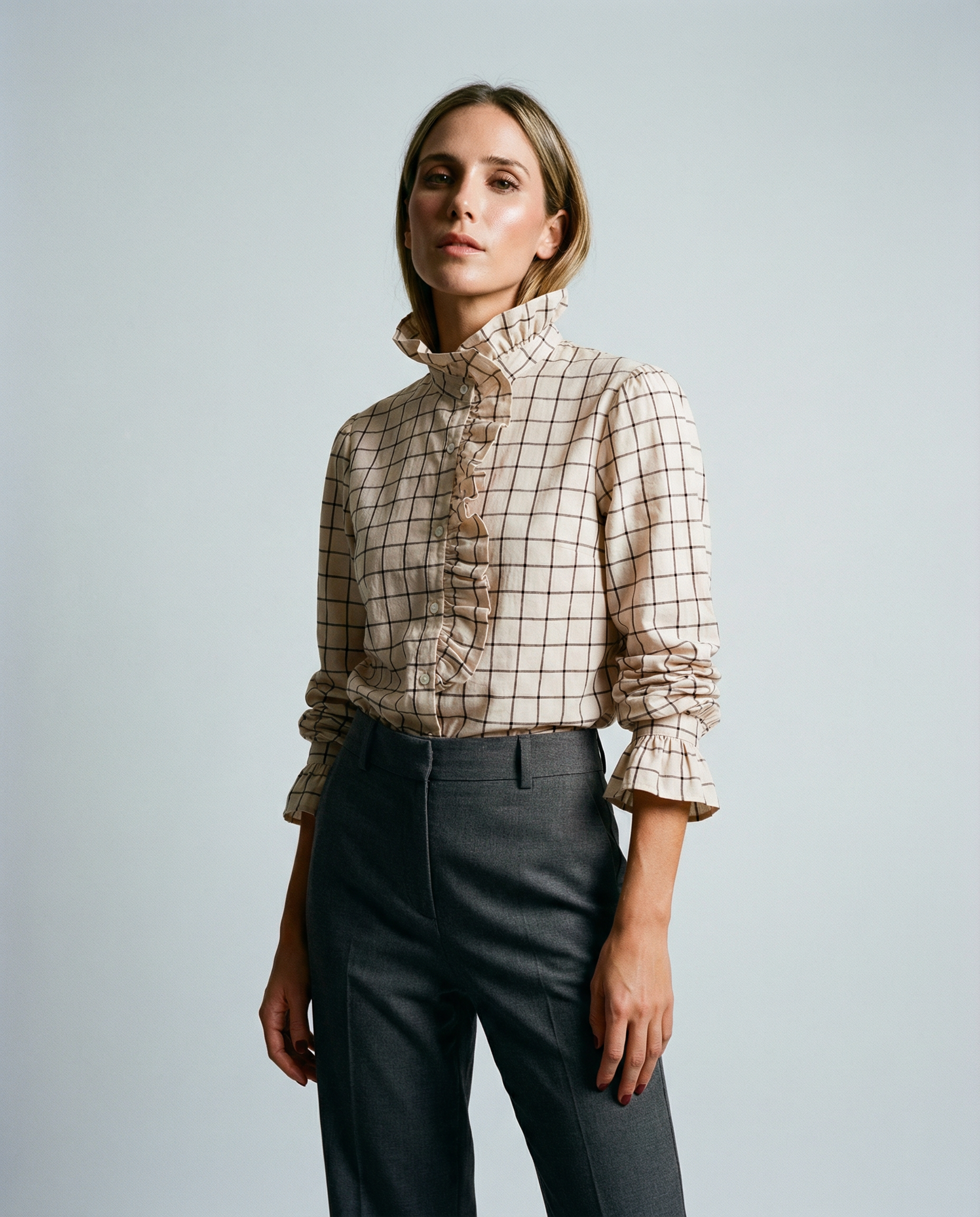 White checked ruffle high-neck blouse with button front and long sleeves