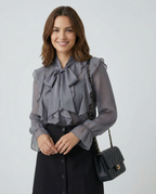Gray chiffon ruffle blouse with bow neck detail and sheer long sleeves