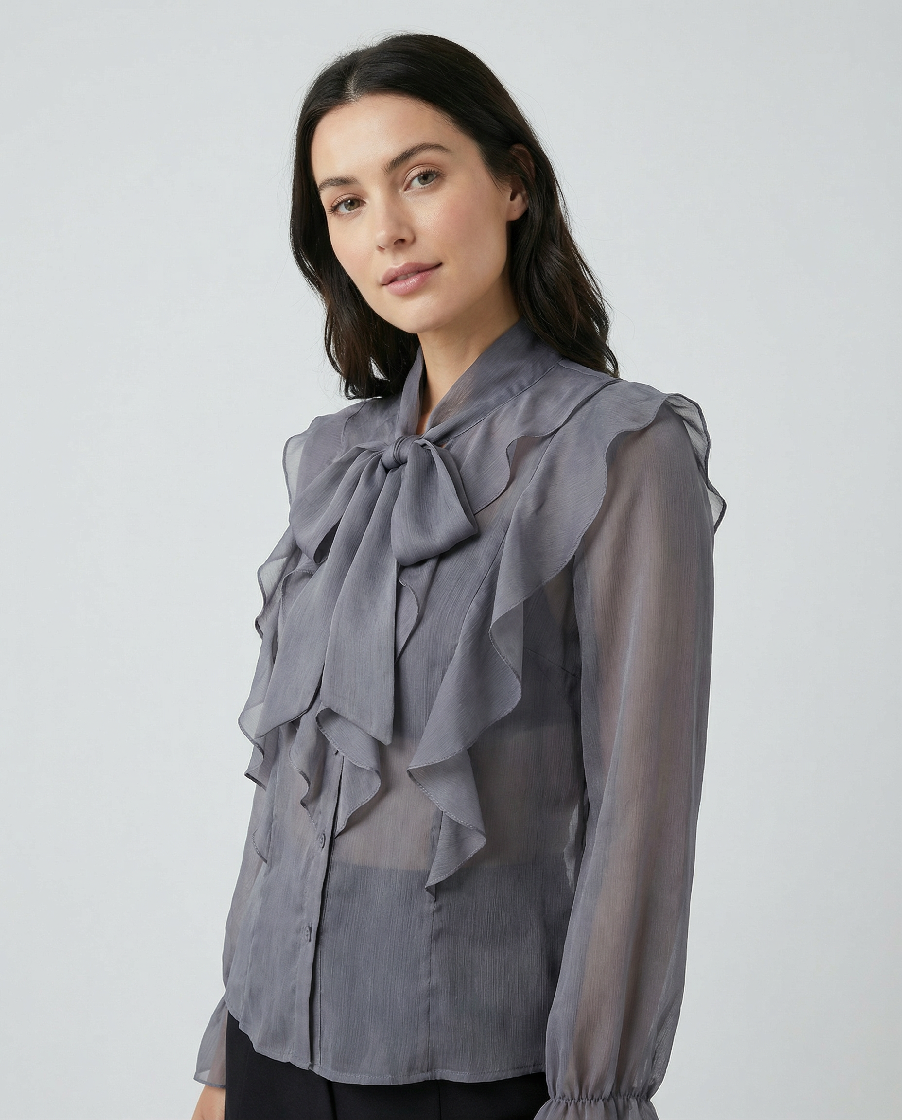Gray chiffon blouse with high bow neckline and layered shoulder ruffles, long sleeves