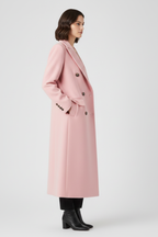 Women’s pink long coat with lapel collar, button fastening, and side flap pockets