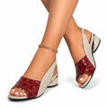 Red sandal with white straps, chain ankle detail, open toe and low block heel
