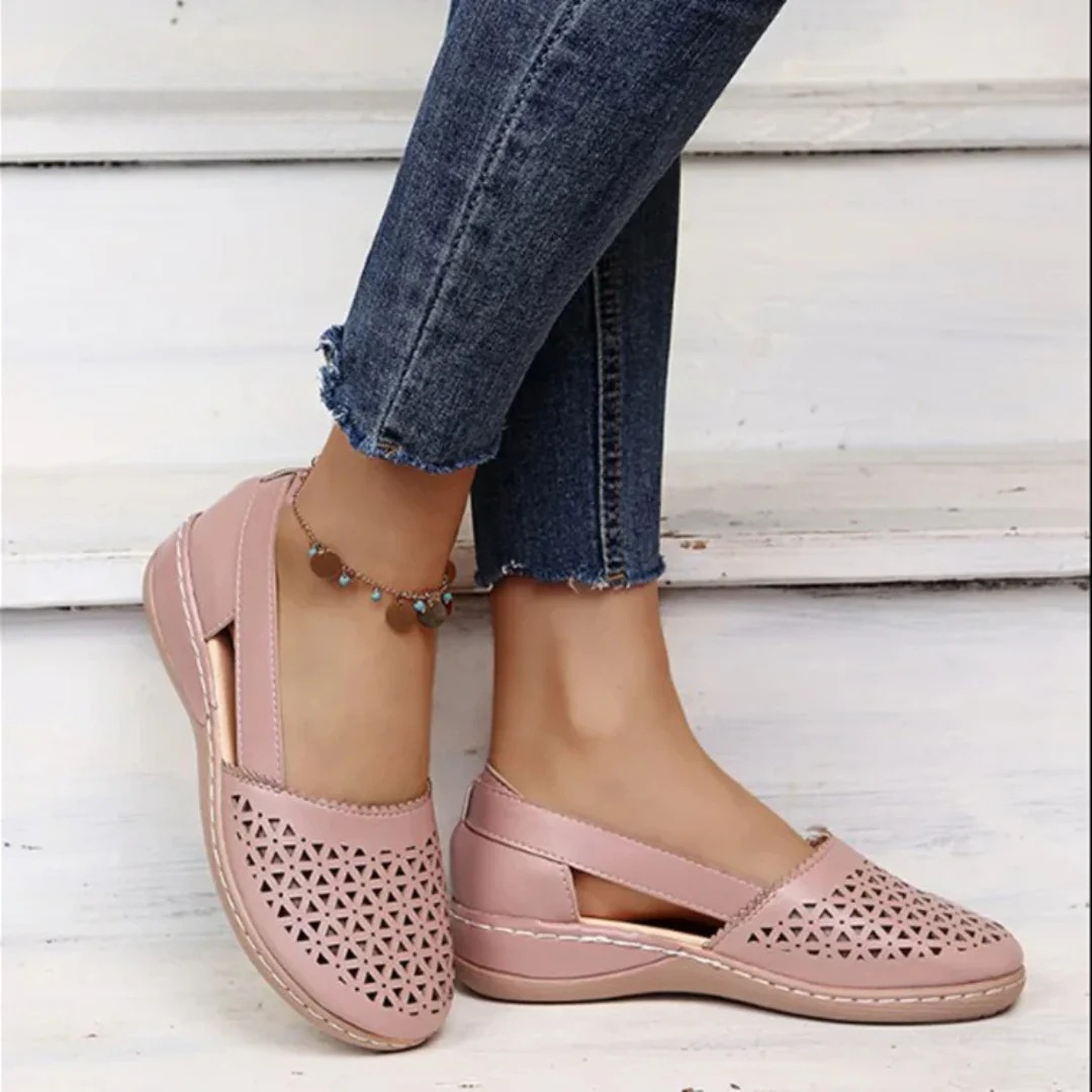 Women’s comfort walking shoes in light pink with perforated slip-on style